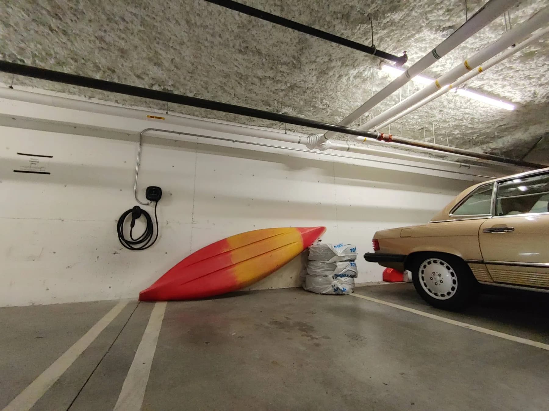 EV charging station installed in a secure underground parking stall