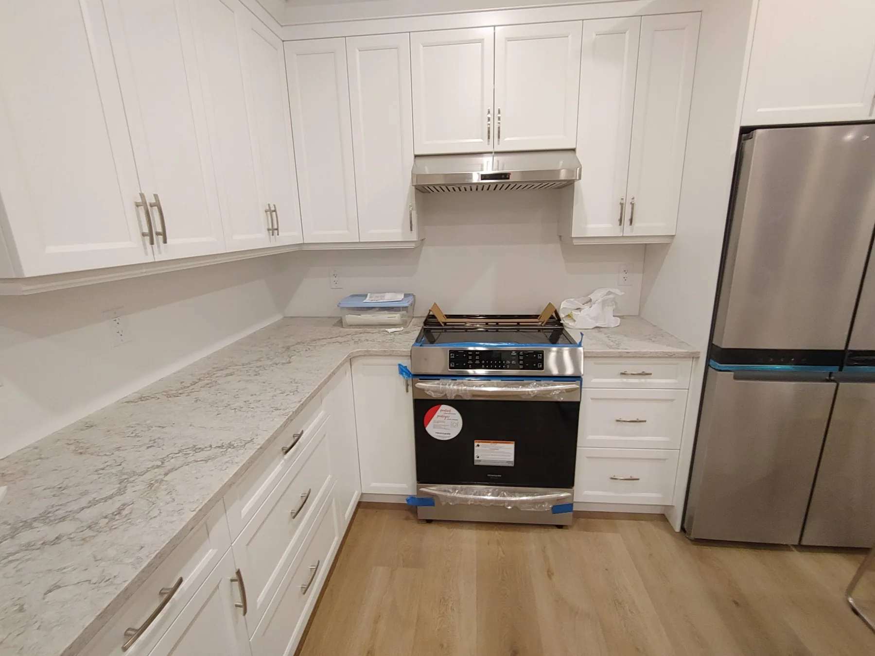 Range, hood and refrigerator circuits completed in a finished kitchen