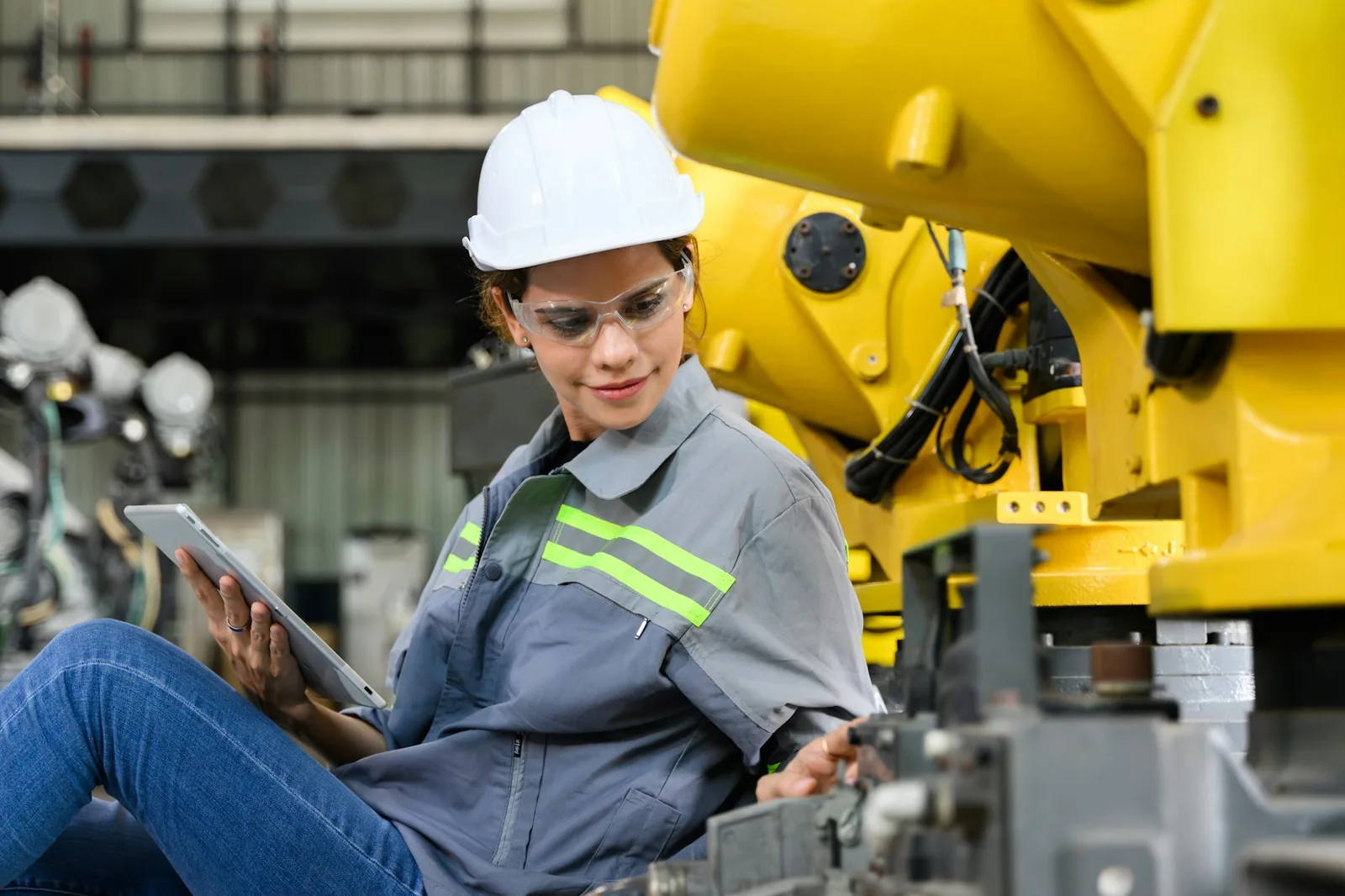 Commercial electrical installation - maintenance engineer worker working with robotic machine automation